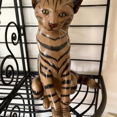 "Striped Cat" by Ed Wicklander, dated 1985, painted wood, 17" x 21" x 8"