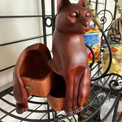 carved wooden cat sculpture with hidden compartment