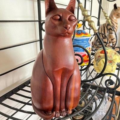 carved wooden cat sculpture with hidden compartment
