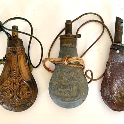 Antique brass, pewter and leather powder flasks