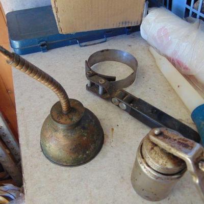 two oil cans, filter wrench