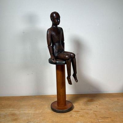 ARTICULATED SCULPTOR'S MODEL  |
Carved wood seated artist's model (without articulating hip joints), resting on a wood spool stand (not...