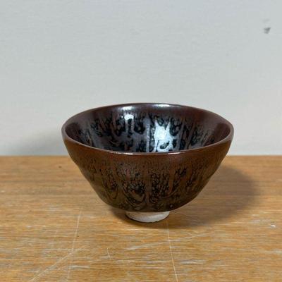 SMALL FLAMBE BOWL  |
Small bowl or tea cup with flambe glaze with iridescence, no apparent marking or signature - h. 2-1/4 x dia. 3-3/4 in.