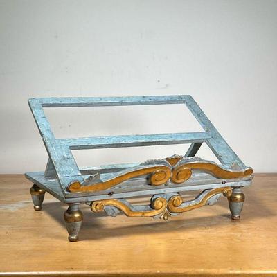 ANTIQUE LECTERN  |
With gray/blue paint with gilt highlights, carved scrolled decoration, raised on four turned feet - l. 15 x w. 11 x h....