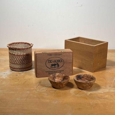LOT DECORATIVE WOOD ITEMS  |
Including a pair of smooth turned wood bowls (dia. 3-1/4 in.), a cigar box, a small woven basket, and an...