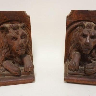 1044	HAND CARVED LION BOOKENDS, APPROXIMATELY 6 IN X 6 IN X 10 IN HIGH
