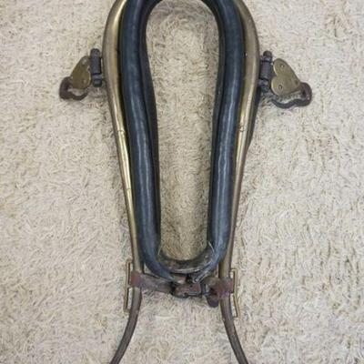 1122	ANTIQUE LEATHER & BRASS HORSE COLLAR, APPROXIMATELY 36 IN HIGH
