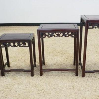 1080	NEST OF 4 ASIAN TABLES W/FRETWORK CARVED SKIRTS, APPROXIMATELY 20 IN X 14 IN X 26 IN HIGH
