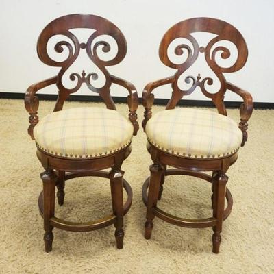 1103	PAIR OF MAHOGANY SWIVEL BAR STOOLS, UPHOLSTERED SEAT W/UNUSUAL SCROLLED HIGH BACK, SOME STAINS, APPROXIMATELY 46 IN HIGH
