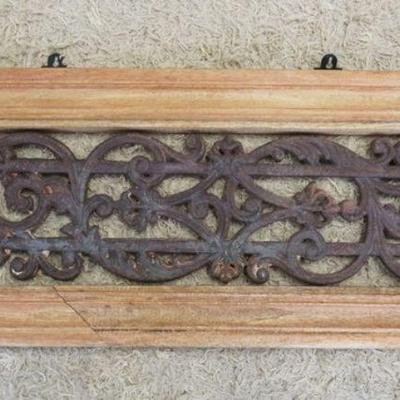 1123	ANTIQUE ORNATE CAST IRON ARCHITECTURAL PIECE IN WOOD FRAME, APPROXIMATELY 16 IN X 35 IN
