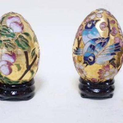 1164	GROUP OF 4 GILT & ENAMELED DECORATED EGGS ON STANDS, APPROXIMATELY 3 IN
