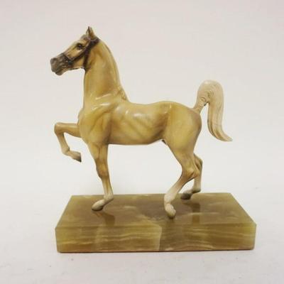 1027	PRANCING HORSE ON ONYX BASE, APPROXIMATELY 3 IN X 6 IN X 7 IN HIGH
