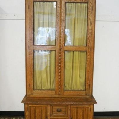 1255	OAK 2 PART DOUBLE GLASS DOOR STEP BACK CASE CONVERTED TO GUN CASE, APPROXIMATELY 18 IN X 44 IN X 84 IN HIGH
