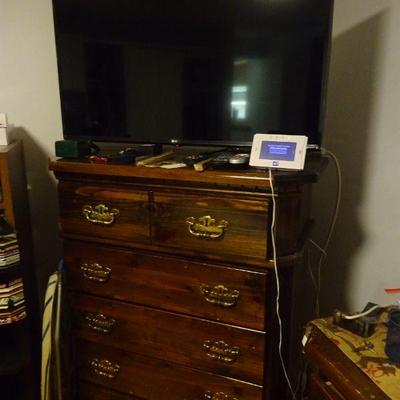 Flat screen t.v. and dresser