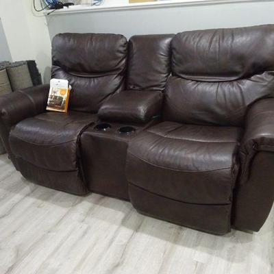Home theatre reclining loveseat with armrest and console