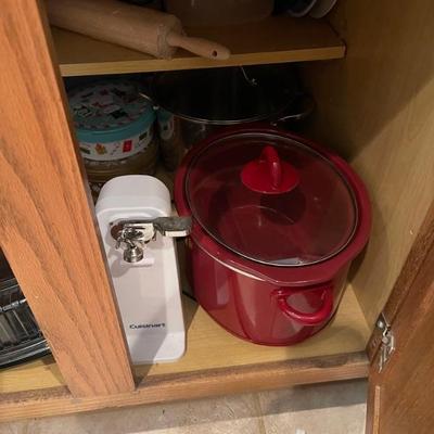 Red crockpot and Cuisinart can opener 