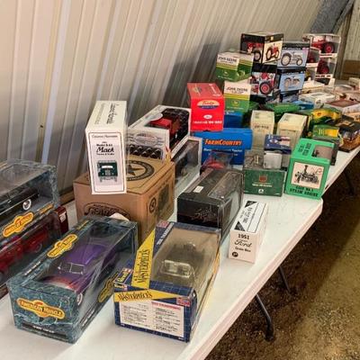 Collection of die-cast tractors, new in box.