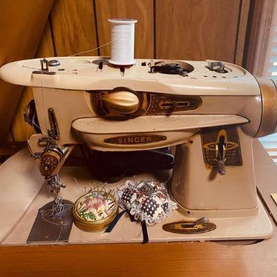 Vintage singer sewing machine in cabinet