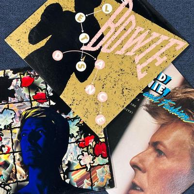 (3pc) DAVID BOWIE RECORDS  |
David Bowie vinyl record albums, including: Tonight; Let's Dance; and Fame and Fashion (David Bowie's All...