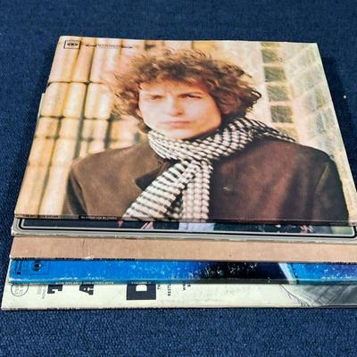 (5pc) BOB DYLAN ALBUMS  |
Vinyl record albums, including: Blonde on Blonde; The Times They Are a Changin'; Desire; Slow Train Coming; and...