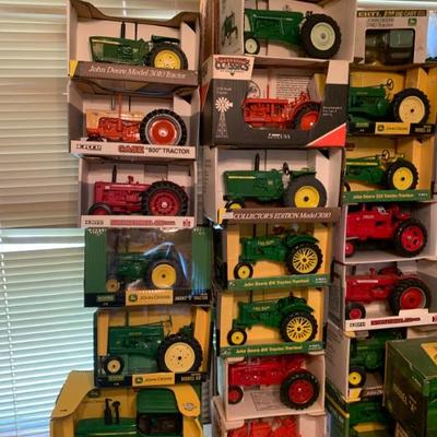 Piles of new in the box collectible tractors many vintage