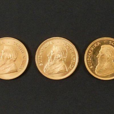 LOT 124: (3) South African 1 oz. Gold Krugerrands.