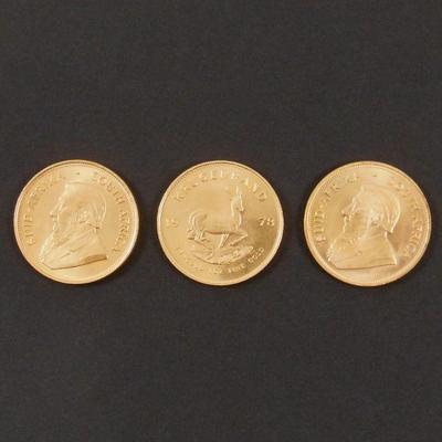 LOT 130: (3) South African 1 oz. Gold Krugerrands.