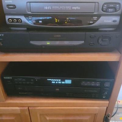 there are two Sony 5 disc CD players, one is brand new (refurbished) plus a VHS player and speakers and more