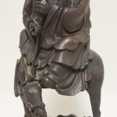 1150	CARVED WOODEN FIGURE OF ASIAN MAN ON HOUSE, SOME LOSS TO CARVING, APPROXIMATELY 18 IN HIGH
