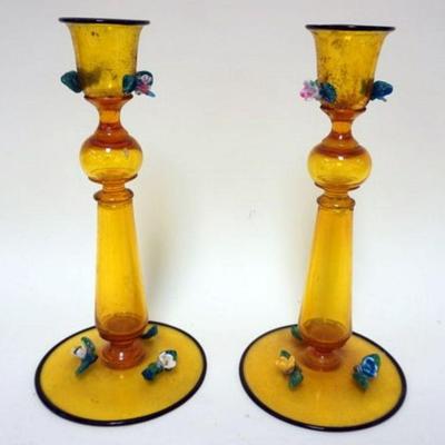 1167	PAIR OF VENETIAN AMBER GLASS CANDLESTICKS W/APPLIED FLOWERS, APPROXIMATELY 10 IN HIGH
