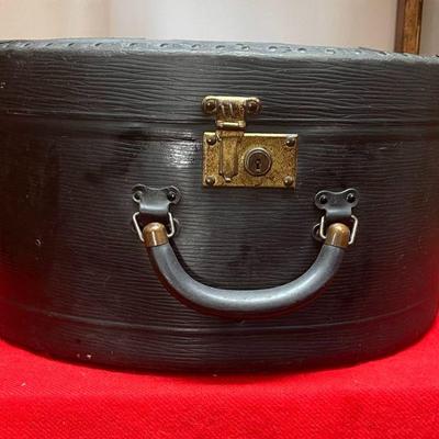 Round Hat Box
The only real damage is that it has a good size tear on topâ€¦ 
