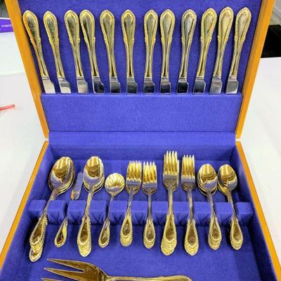 One of two sets of gold tone flatware