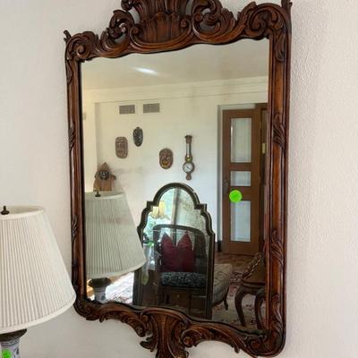 beautiful mirror with carved wood frame