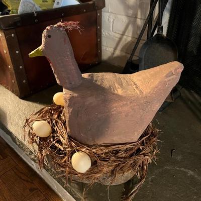 concrete folk art hen on nest