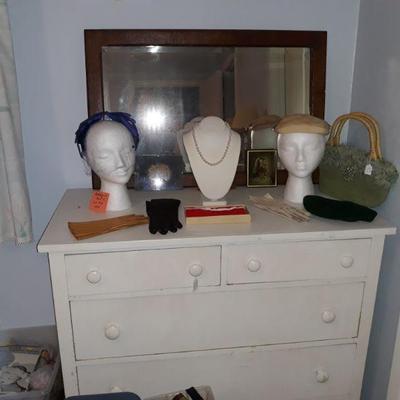 Vintage hats, handbags, gloves, pearl necklaces, mirror, and antique dresser