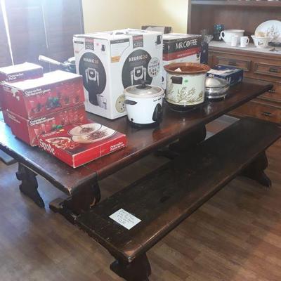 Kitchen tanke with two benches and boxed dishes and NIB coffee makers