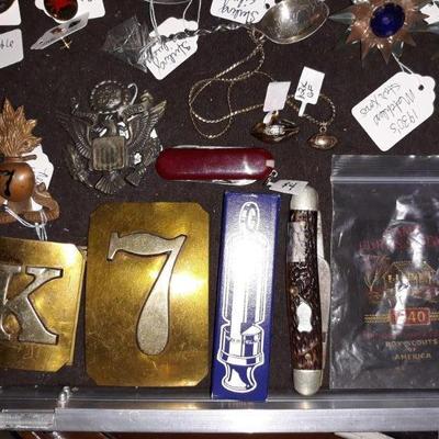 Antique New York Army National Guard badges and buckles