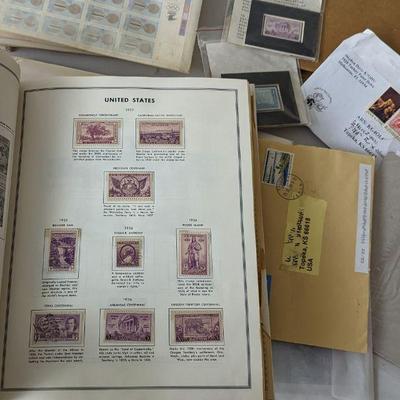 Check out this Stamp Collection!!  US, and Worldwide stamps... circulated and uncirculated both!
