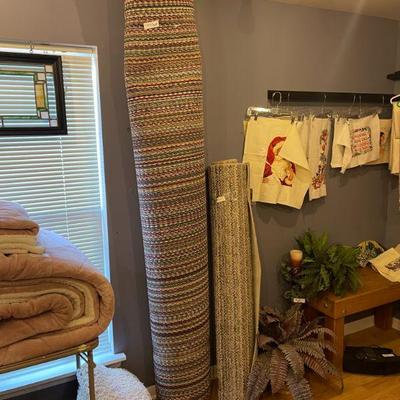 Rugs, bedding and needlepoint.   (Bench not for sale)