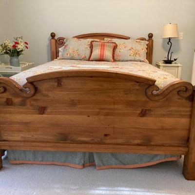 Queen size pine bed.