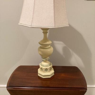 Single cream with green embellishments table lamp.
