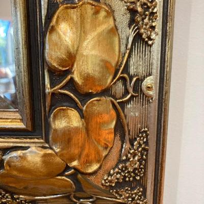 Close up detail on wall mirror.