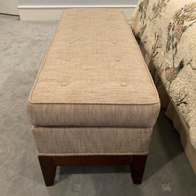 Upholstered storage ottoman measures 20" x 50"