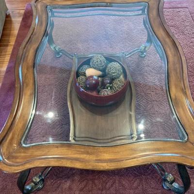Wood trim with iron base & glass top.  46" x 34" x 20" tall