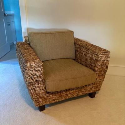 Gorgeous two cushion rattan chair. Chair measures approximately 40" wide x 31" high