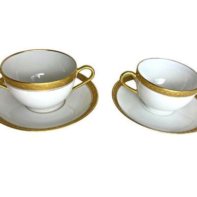 pair of Limoges French genuine gold on white porcelain bouillon cups, one Jean Boyer