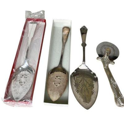 collection of silverplate servers, including William Rogers bicentennial commemorative server