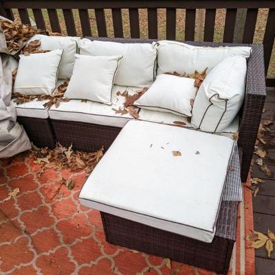 Outdoor wicker style sectional with new cushions.