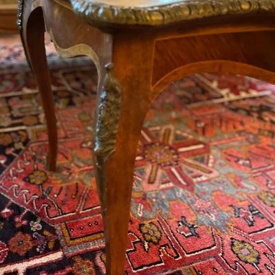 Gorgeous Brass Accents protect the cabriole legs and edges of this cocktail table