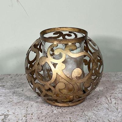 SCROLLWORK CANDLE HOLDER  |
Round open work gold-toned candle holder with a rippled glass shade - h. 8 x dia. 8 in.